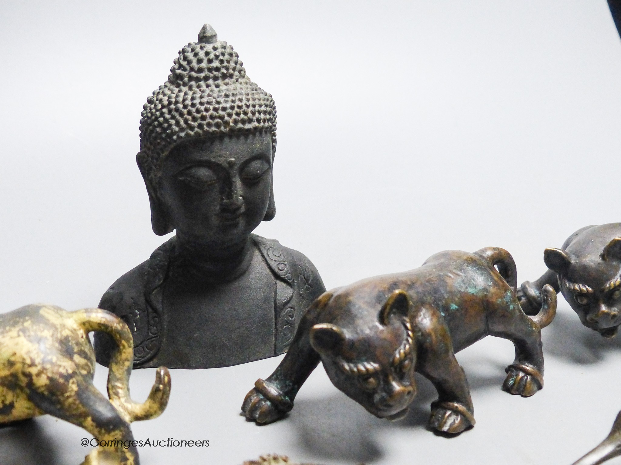 A group of nine Chinese and Oriental bronze figures to include five Han Dynasty style bronzes, tallest 12cm